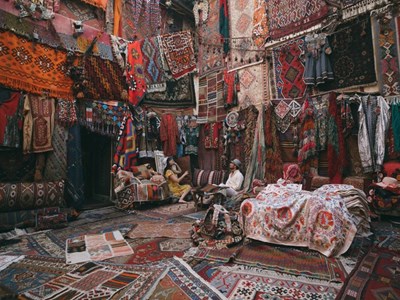 Young tourists enjoying at traditional carpet shop in Cappadocia Turkey